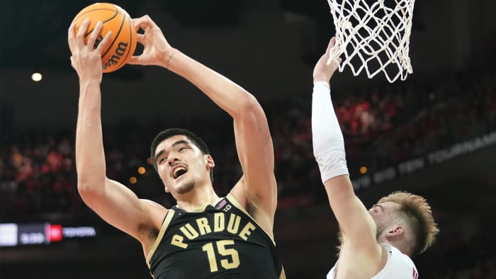 Purdue Boilermakers center Zach Edey rebounds against Wisconsin.